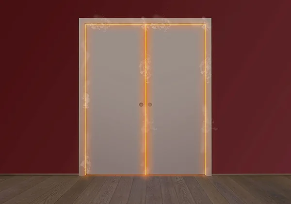 A pair of fire rated pocket doors closed in a deep red wall, edges glowing to show the intumescent seal line